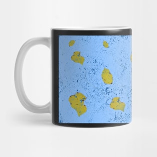 Yellow leaf on blue bg Mug